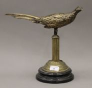 A bronze model of a pheasant on an adapted stand