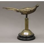 A bronze model of a pheasant on an adapted stand