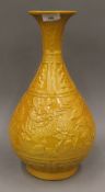 A Chinese yellow ground pottery vase