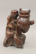 An unusual Chinese antique hardwood carving of a scholar. 21 cm high.