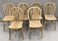 A set of six 19th century elm seated wheel back country chairs