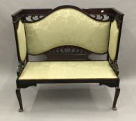 An Edwardian mahogany framed salon settee