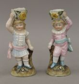 A pair of 19th century Continental porcelain figural candlesticks