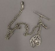 An Edwardian silver watch chain and a fob (43.