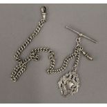 An Edwardian silver watch chain and a fob (43.