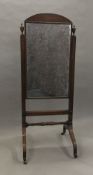 A Regency mahogany cheval mirror. 163 cm high.