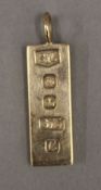 A 9 ct gold ingot pendant (7 grammes)