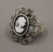 A silver cameo and marcasite set ring