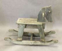 A wooden child's rocking horse