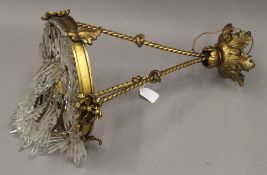 A 19th century brass hanging light with cut glass droplets