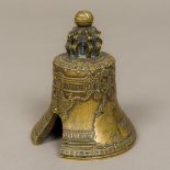 A small patinated bronze model of the Tsar Bell Decorated in relief with images of baroque angels,