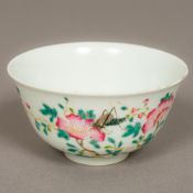 A Chinese porcelain bowl Decorated with insects amongst floral sprays,