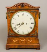 A 19th century mahogany bracket clock The serpentine top above the white dial with Roman numerals