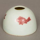 A Chinese Ming porcelain brush washer Of beehive form decorated with fish. 5.5 cm high.