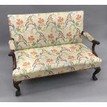 A late 19th/early 20th century 18th century style mahogany settee The overstuffed back issuing twin