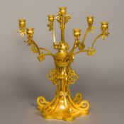 An early 19th century Gothic Revival ormolu six branch candelabrum The scrolling pierced uprights