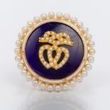 A Victorian seed pearl and enamel decorated gold brooch Of circular form,