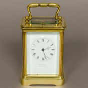 A 19th century French brass cased repeating carriage clock retailed by W Leuchars,