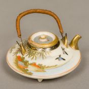 A Meiji period Japanese Satsuma miniature teapot Of flattened circular form,