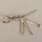 An 18th/19th century Continental silver smoker's multi-tool tamper The loop handle with scrollwork