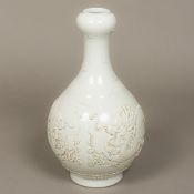 A Chinese porcelain garlic neck bottle vase With allover white glaze decorated with two five clawed