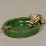 A spinach jade ashtray Formed as an oval pool,