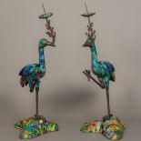 A pair of Chinese brightly decorated pricket stick censers Modelled as cranes standing on brightly