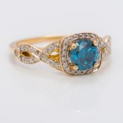 A 10 K gold blue and white diamond ring The central facet cut blue diamond approximately 0.