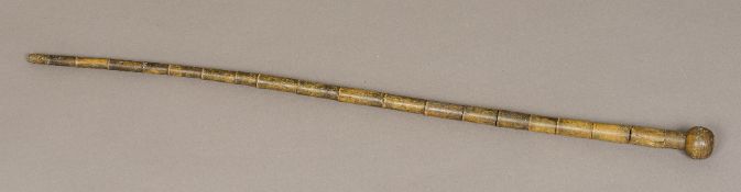 A 19th century horn walking stick Of segmented form, with turned knop handle. 84 cm long.