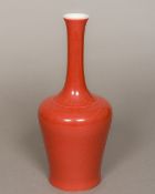 A Chinese porcelain bottle vase With all over red glaze,