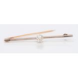 An unmarked 14 ct gold diamond solitaire bar brooch The central old cut stone approximately 0.