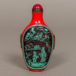 A Chinese Peking glass snuff bottle and stopper Worked with landscape vignettes interspersed with