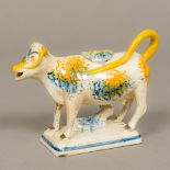 A Georgian Whieldon type spongeware pottery cow creamer Modelled as a standing cow with calf