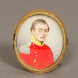 An early 19th century portrait miniature on ivory Depicting a young military officer in red tunic
