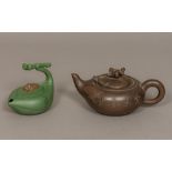 Two Chinese Yixing pottery teapots One worked with a boy riding a water buffalo,