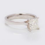 A diamond and platinum solitaire ring Set with a 1.51 carat princess cut diamond. 7 cm high.