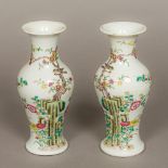 A pair of Chinese porcelain baluster vases Each worked with a gnarled bough issuing flowers.