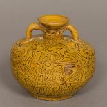 A Chinese Tang Dynasty pottery twin handled vase With marbled decoration. 9.5 cm high.