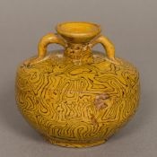 A Chinese Tang Dynasty pottery twin handled vase With marbled decoration. 9.5 cm high.