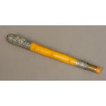 An early Edwardian silver mounted rhino horn parasol handle The silver top hallmarked for
