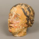 A 19th century polychrome painted carved wooden head Modelled as a woman. 21 cm high.