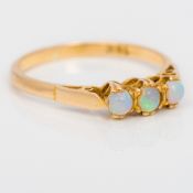 An 18 ct gold opal set three stone ring