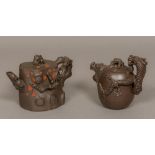 Two Chinese Yixing pottery teapots One faux-bois, the other worked with a dragon, impressed marks.