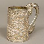 A late 19th/early 20th century Chinese silver tankard Of spreading cylindrical form with scrolling