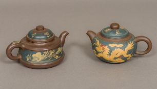 Two Chinese Yixing pottery teapots One decorated with a dragon opposing a phoenix,