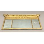 An early 19th century gilt framed triple plate over mantle mirror The inverted breakfront beaded