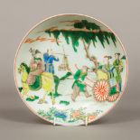 A Chinese porcelain dish Worked with figures, blue painted six character Kangxi mark to base.