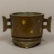 A Chinese patinated bronze gold splash censer on stand Of cylindrical form with twin lug handles,