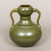 A Chinese porcelain twin handled double gourd vase With allover green glaze,