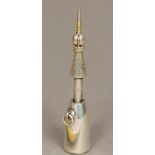 A white metal novelty propelling pencil by Hamilton & Co., Calcutta Modelled as a champagne bottle.